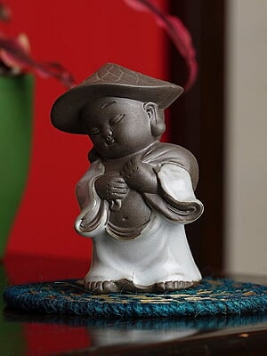 Serene Monk Statue with Traditional Hat for Home and Office Decor